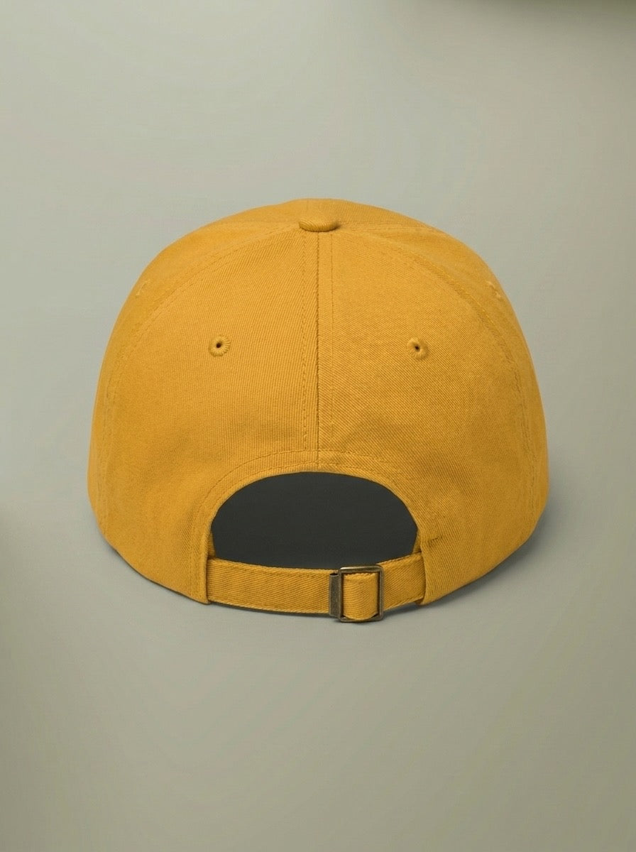 Back of the mustard yellow chili cook-off hat, showing the adjustable strap.