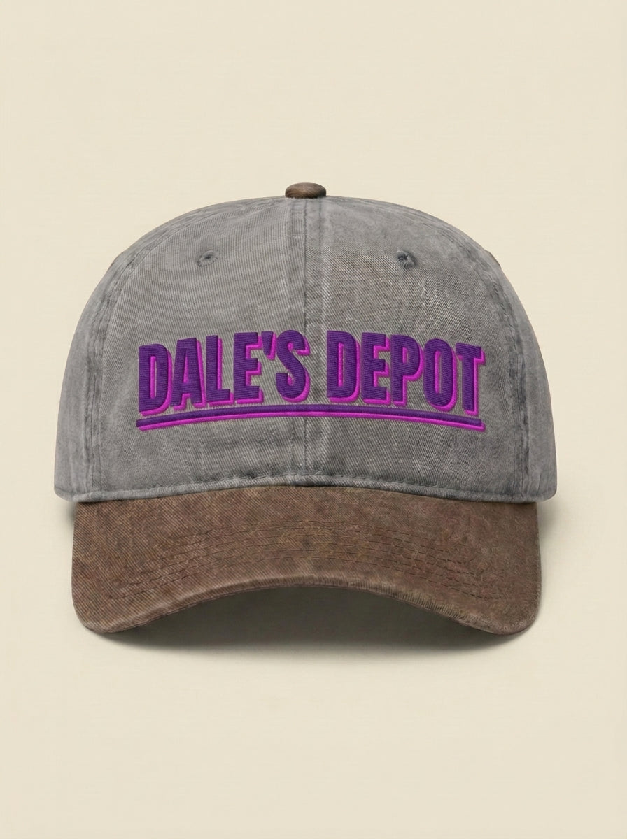 Grey dad hat with a brown brim, embroidered with DALE'S DEPOT in purple.