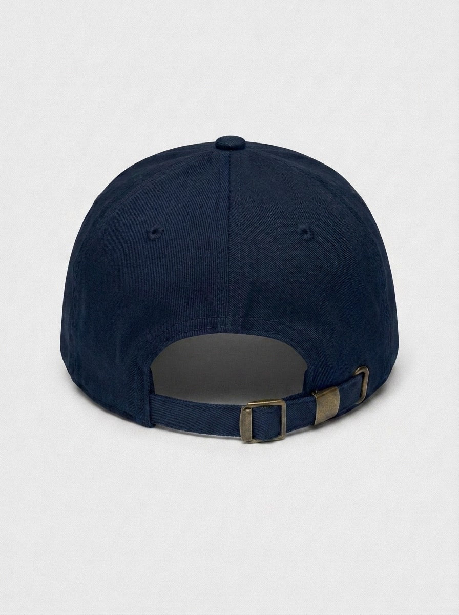 Back of the navy employee of the month hat, showing the adjustable strap and brass buckle.