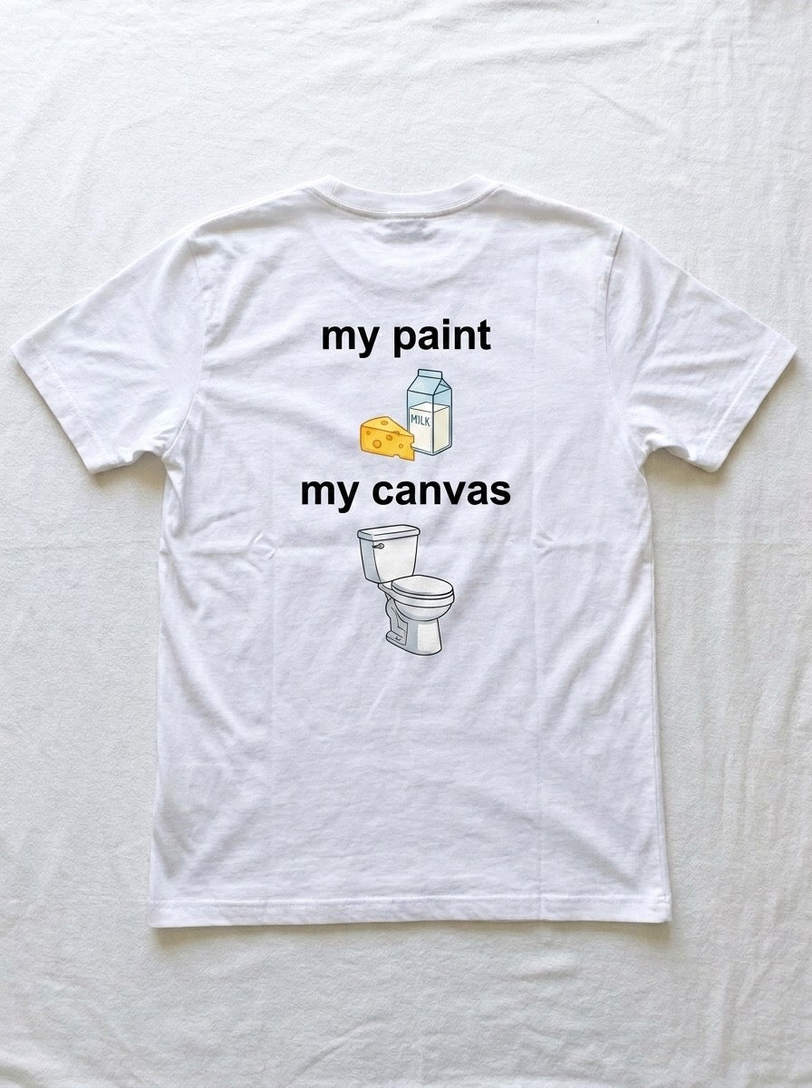 Back of a white t-shirt printed with the words my paint above a carton of milk and a wedge of cheese, and the words my canvas above a toilet.