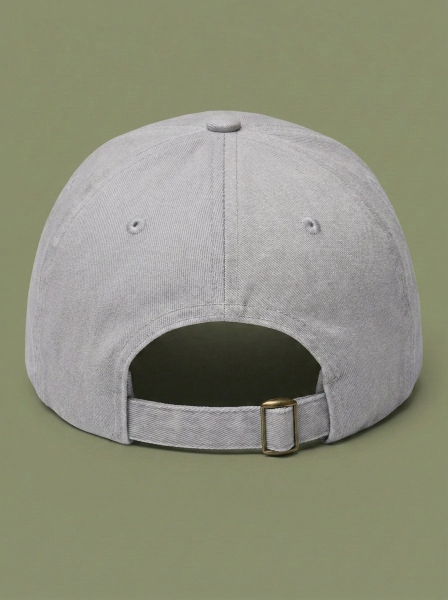 Back of the light grey STILL RENTING hat, showing the adjustable strap.
