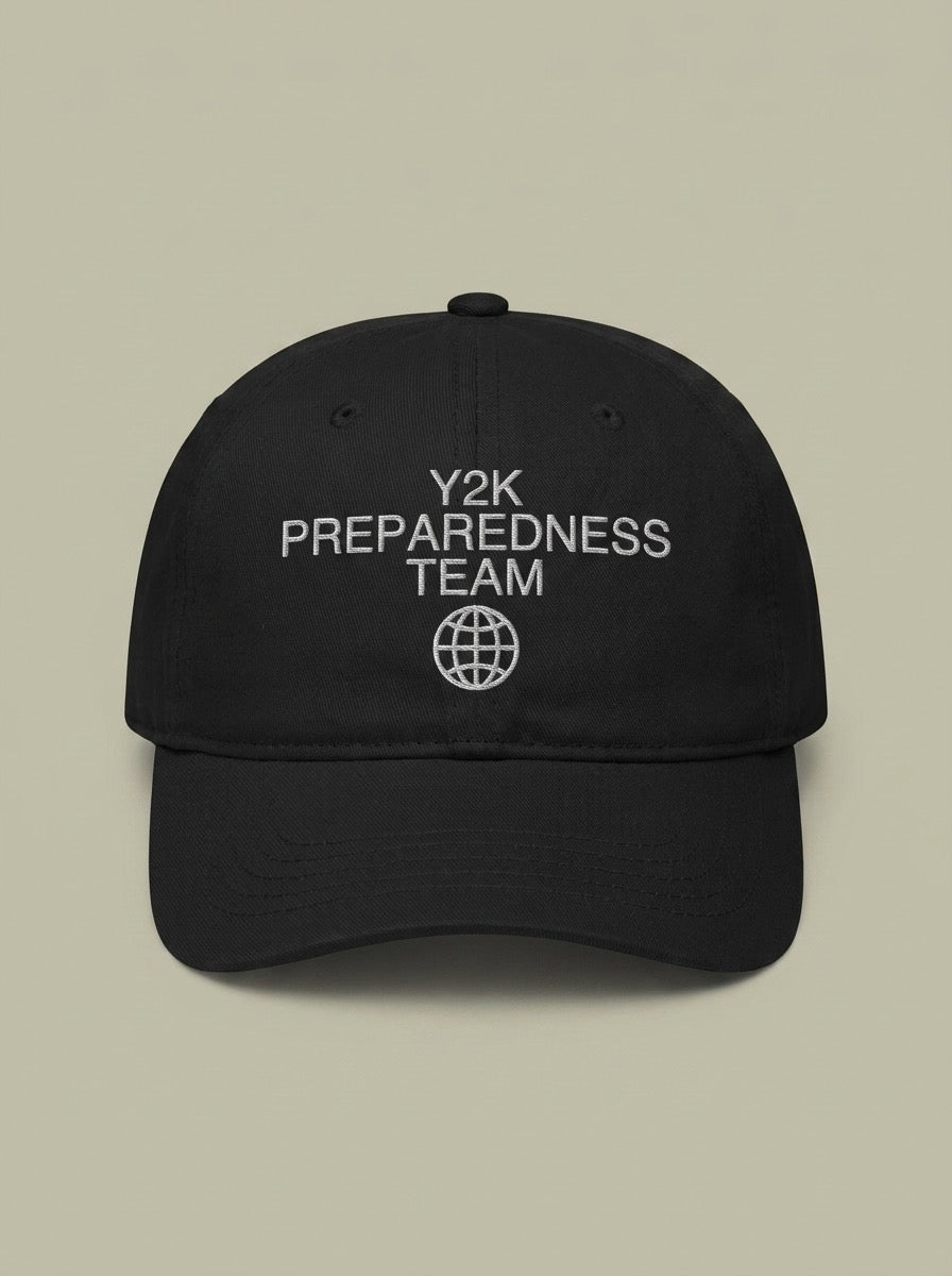 Black dad hat embroidered in silver-grey with Y2K PREPAREDNESS TEAM above a globe.